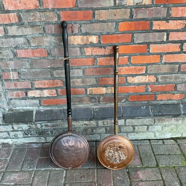 Pair of antique copper bed pans with long handles.