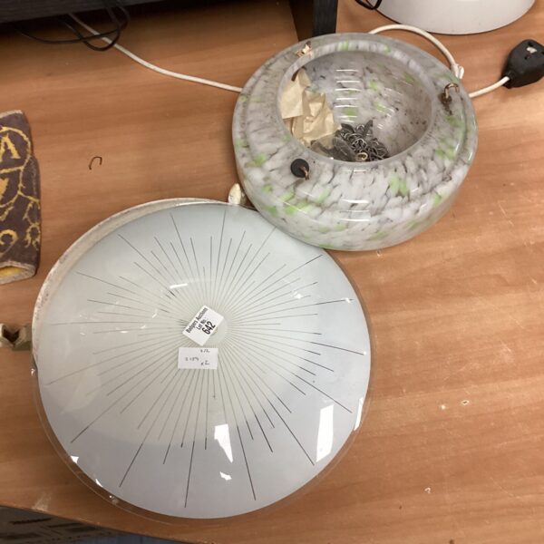 Pair of vintage glass lamp shades with green and white mottling.