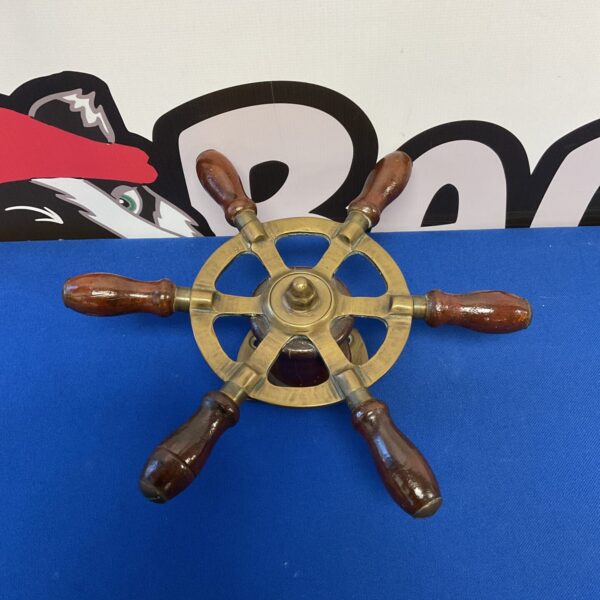 Vintage brass and wood boat steering wheel, nautical marine wheel.