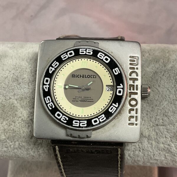 Vintage Michelotti wristwatch with bold dial and stainless steel case.