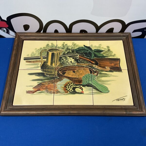 Vintage ceramic tile plaque featuring a pheasant and hunting display.