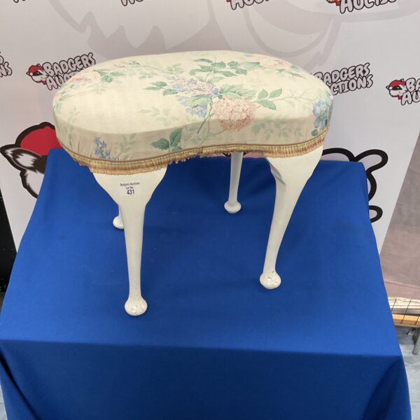 Vintage floral dressing table stool with tapered legs.