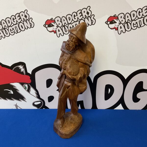 Vintage German carved wooden vagabond sculpture, detailed folk art.