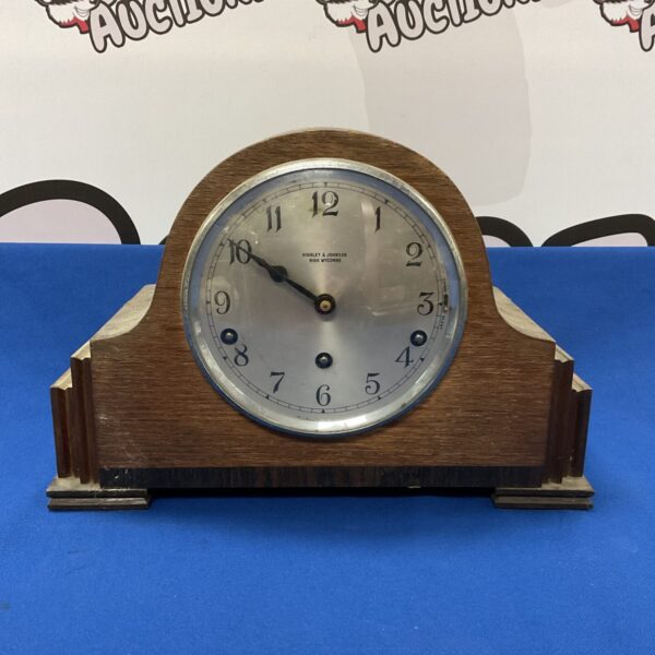 Vintage Highley & Johnson mantle clock with Roman numerals.