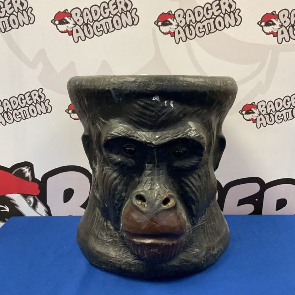 Vintage leather gorilla head footstool, mid-century modern decor.