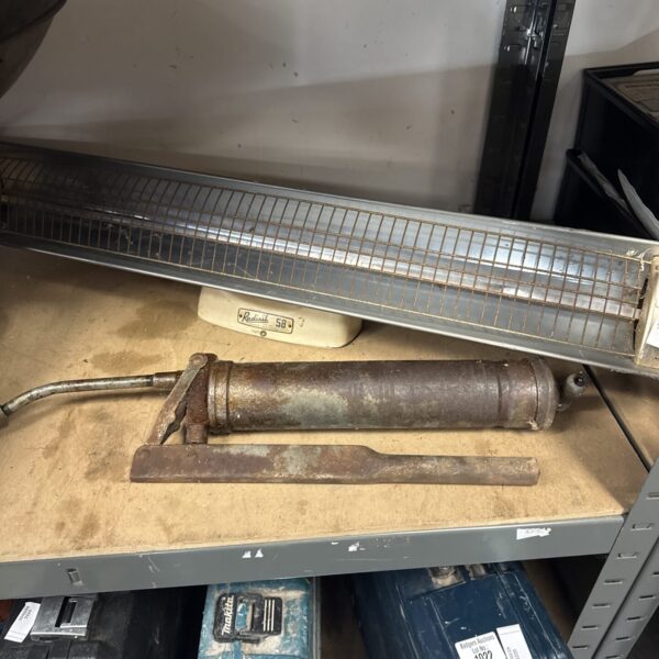 Vintage Radisil 58 heat lamp with grease gun, antique tool.