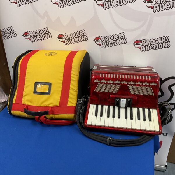 Vintage red accordion with its original hard case.