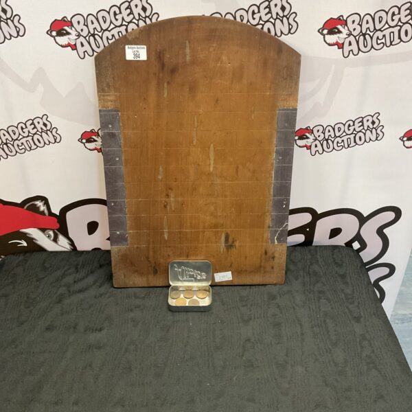 Vintage shove hapeny board with half pennies for retro gaming.