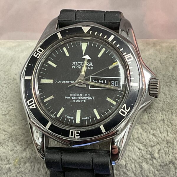 Vintage Sicura divers watch with black dial and day date.