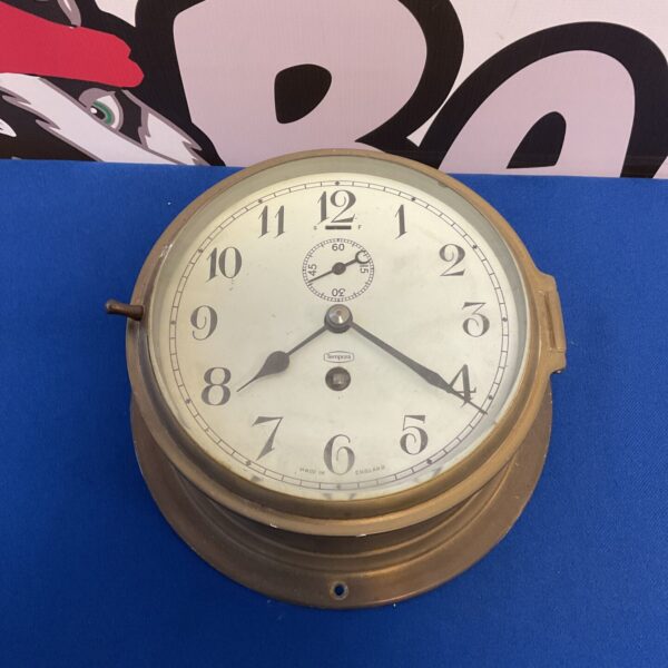 Vintage Tempora brass ships clock with Roman numerals.