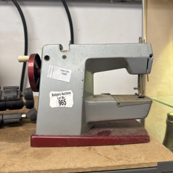 Vintage Vulcan sewing machine with hand crank mechanism.
