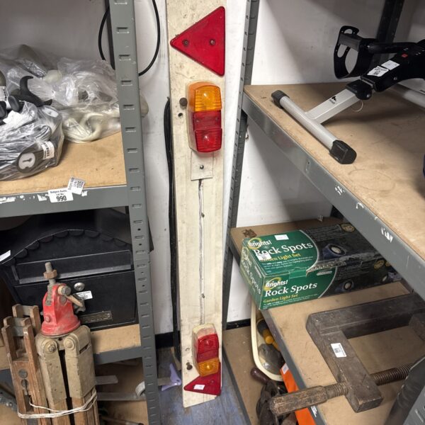 Vintage trailer lightboard with red and amber rear lights.