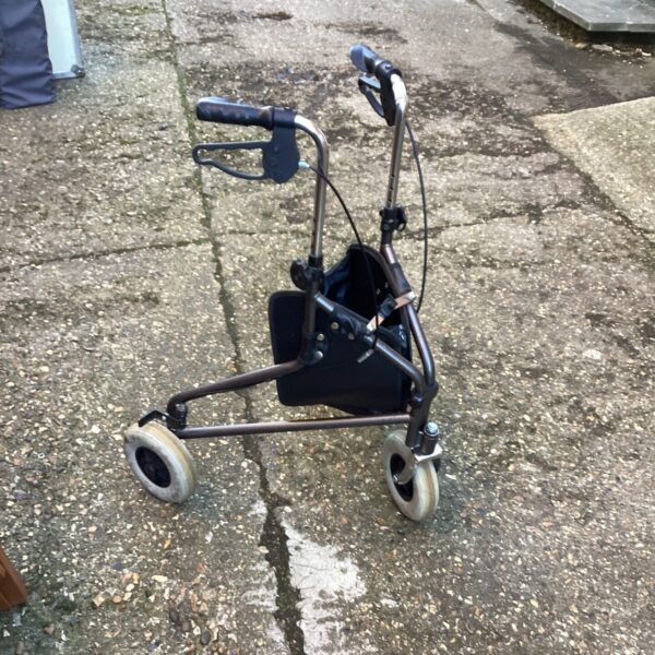 Front view of a three-wheeled Triwalker walking aid.