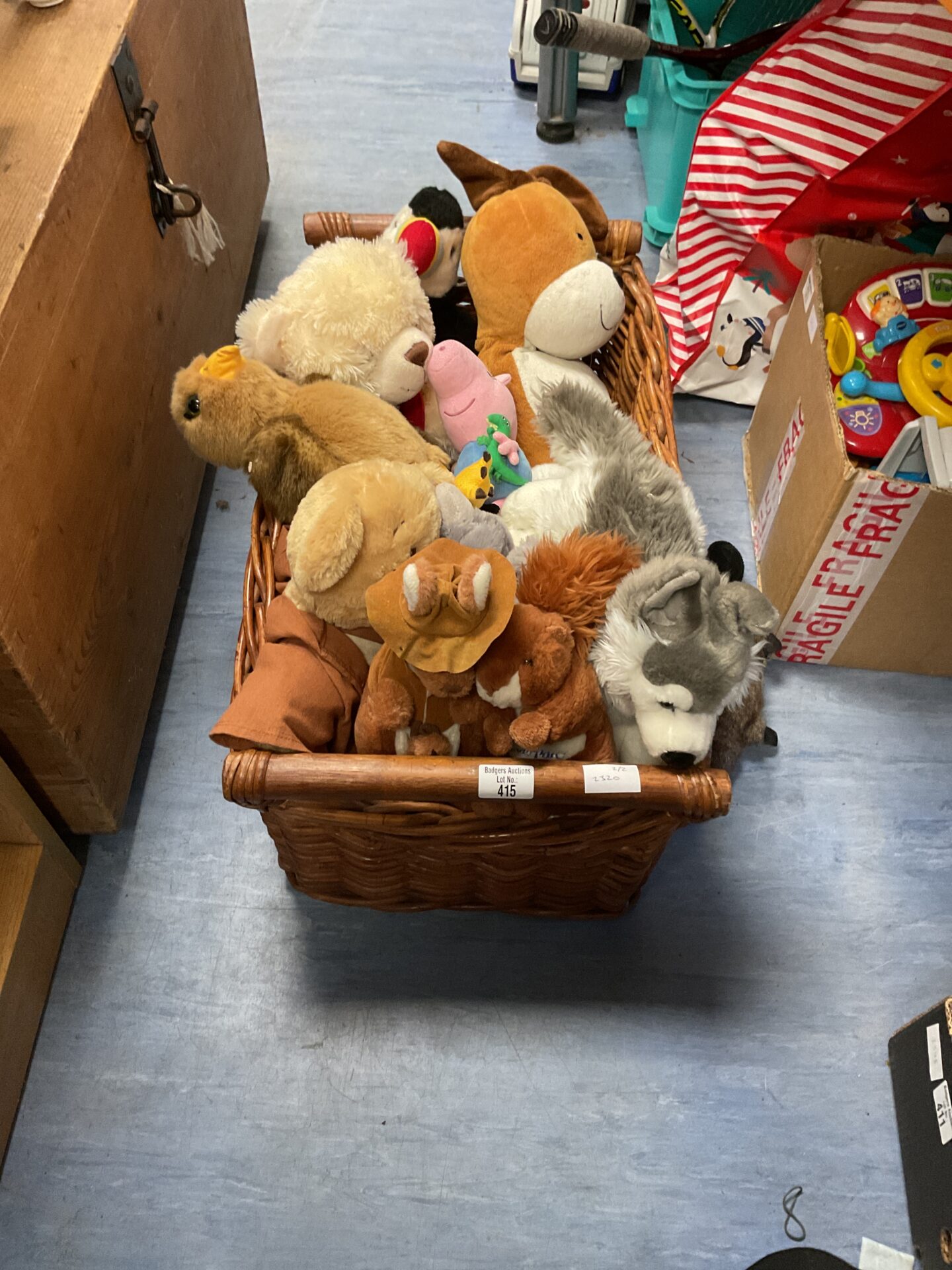 415 Wicker basket containing mixed soft toys and teddies