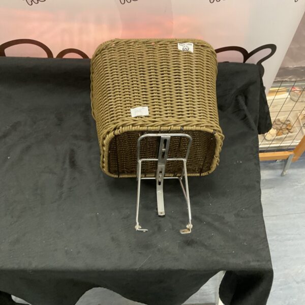 Vintage wicker bicycle basket with woven pattern.