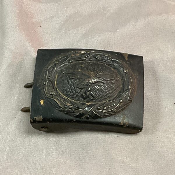 Vintage WWII German Luftwaffe belt buckle with eagle emblem.