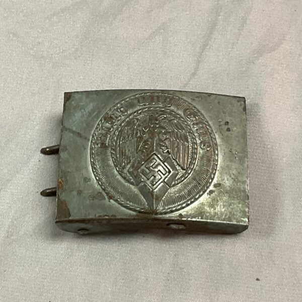 Front view of a WWII Hitler Youth belt buckle with swastika.