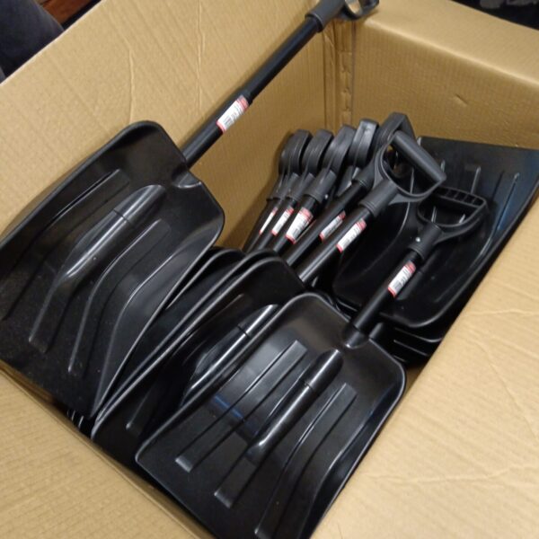 Large lot of new folding snow shovels in a cardboard box.