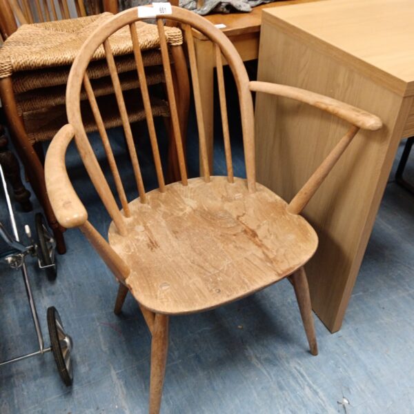 Vintage Ercol carvery chair with stick back design.