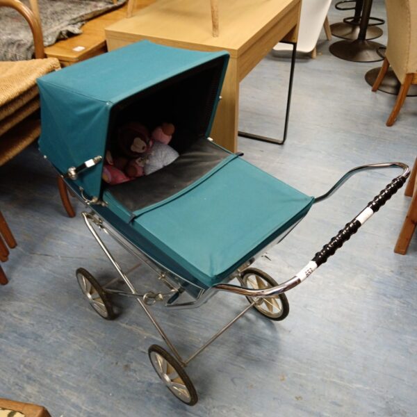 Vintage Silver Cross dolls pram with blue hood and silver frame.