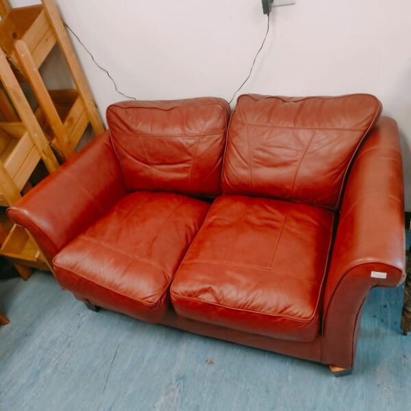 Vintage brown leather two-seater sofa in good condition.