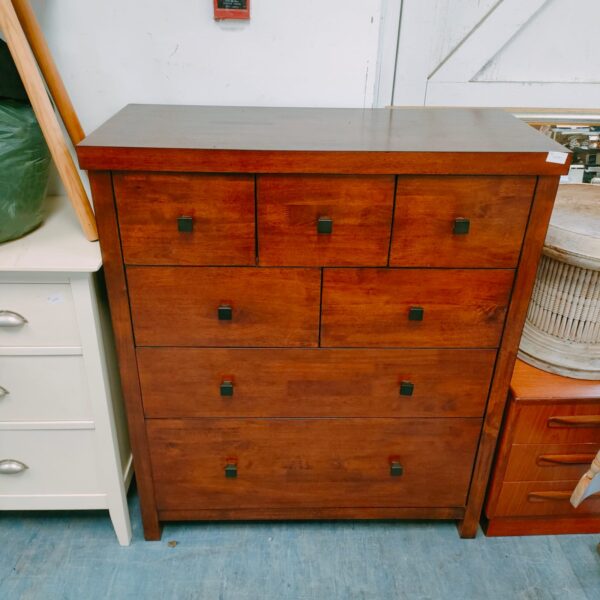 Wooden John Lewis chest of drawers with four drawers.