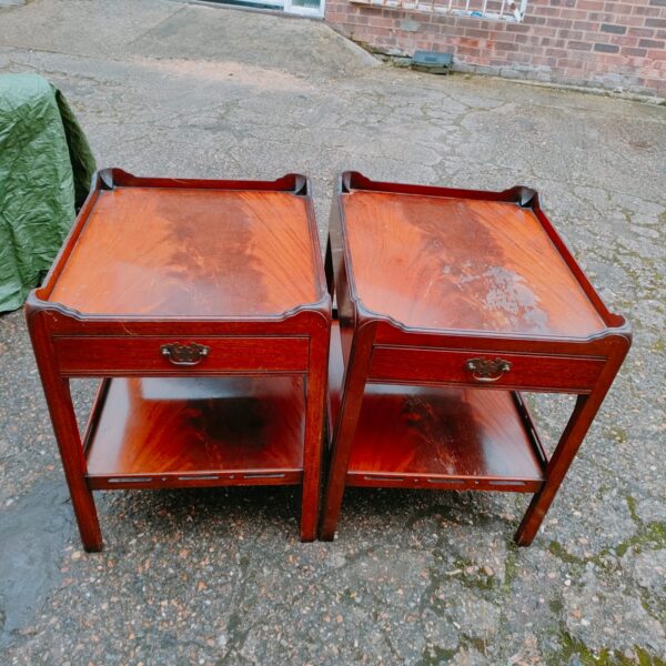 Pair of vintage mahogany magazine tables with lower shelf.