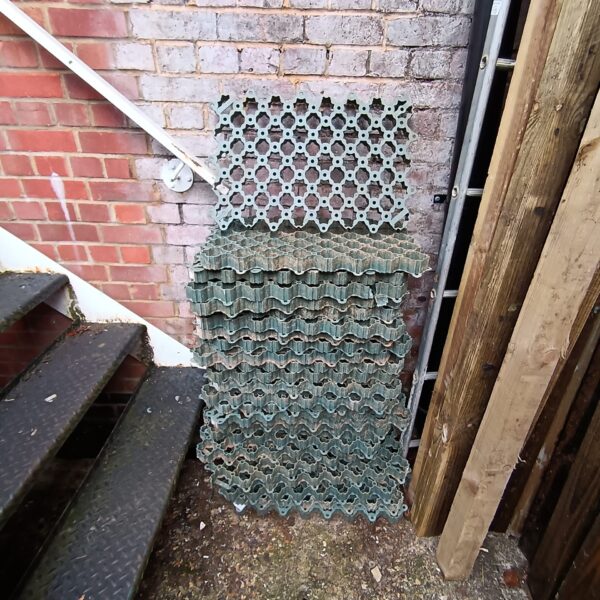 Lot of used plastic lawn paving grids for driveways.