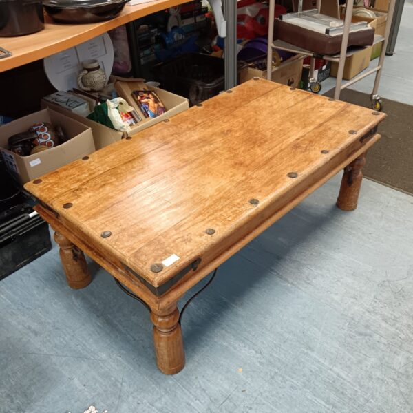 Warm toned Indian oak coffee table with turned legs.