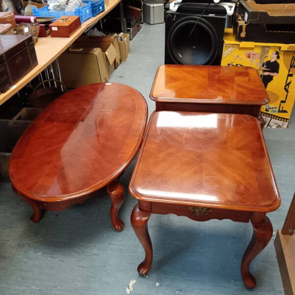 Harrods fruitwood magazine tables set in a warehouse.