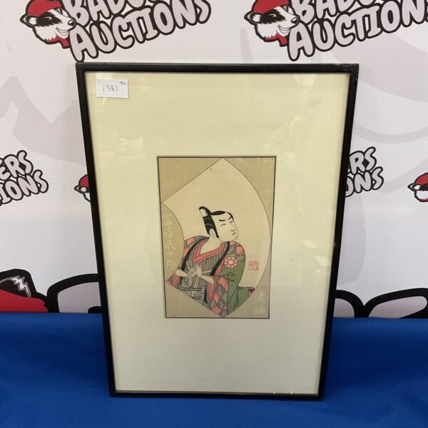 Antique Japanese woodblock print of a Kabuki actor in vibrant costume.