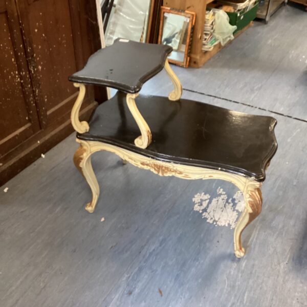 Antique French telephone table with decorative cabriole legs.