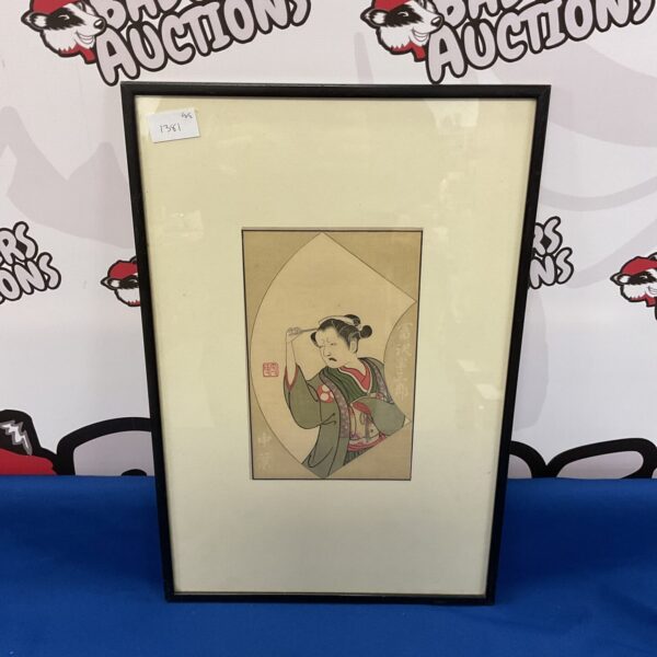 Antique Japanese woodblock print of a female actor in traditional costume.