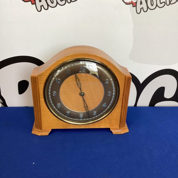 Vintage Bentima mantle clock with wooden case and dial.