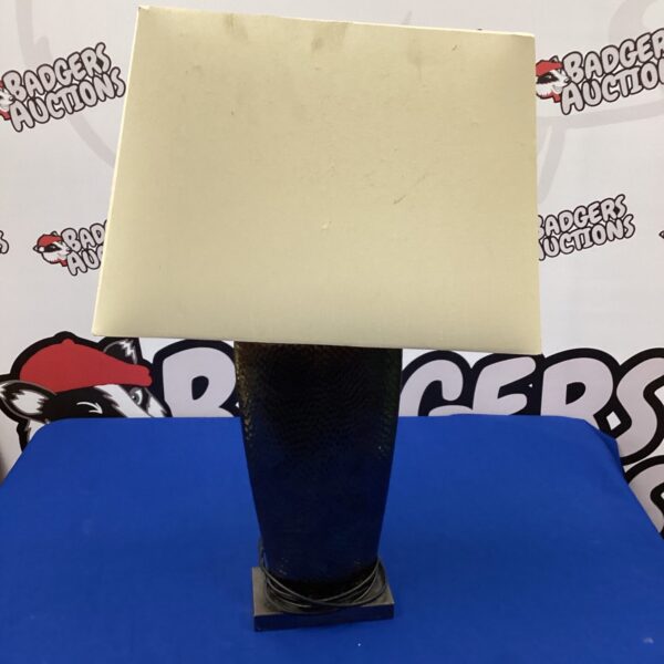 Vintage bronze table lamp with a classic shade.