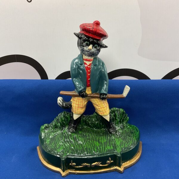 Vintage cast iron golfing cat doorstop, antique collectible figurine.