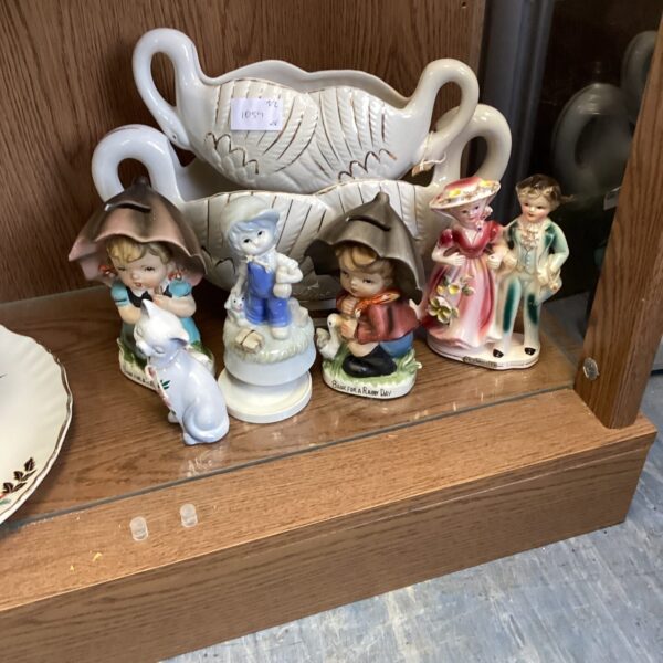 Vintage porcelain figurines and flower holder collection.