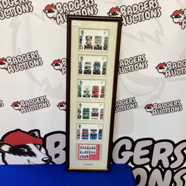Framed collection of vintage Royal Mail bus stamps for collectors.