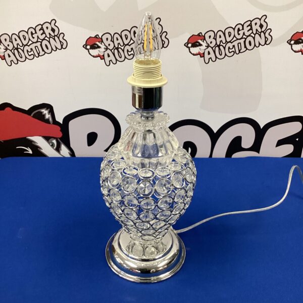 Vintage glass table lamp with chrome base and faceted shade.