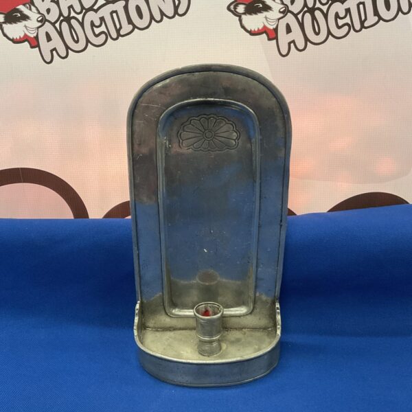 Vintage pewter candle sconce with floral design.