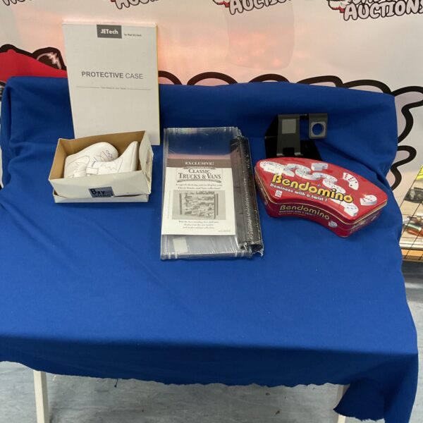 Mixed lot of diecast vehicles, dominos, and an iPad case.