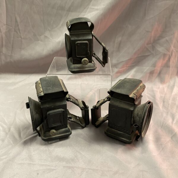 Group of three vintage car oil lamps, antique lighting.