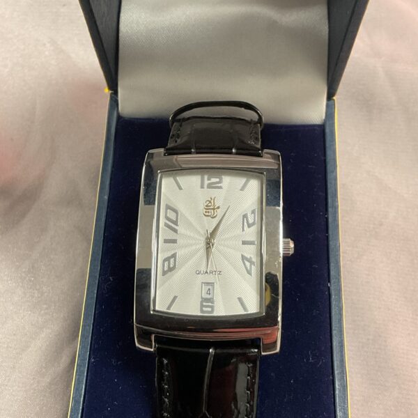 Front view of a vintage Emirates Quartz wristwatch with black strap.