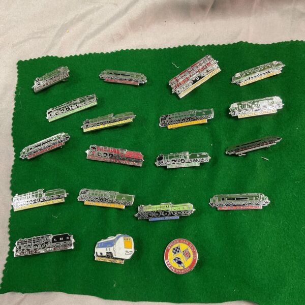 Vintage train pin badges lot, railway collectibles and enamel badges.