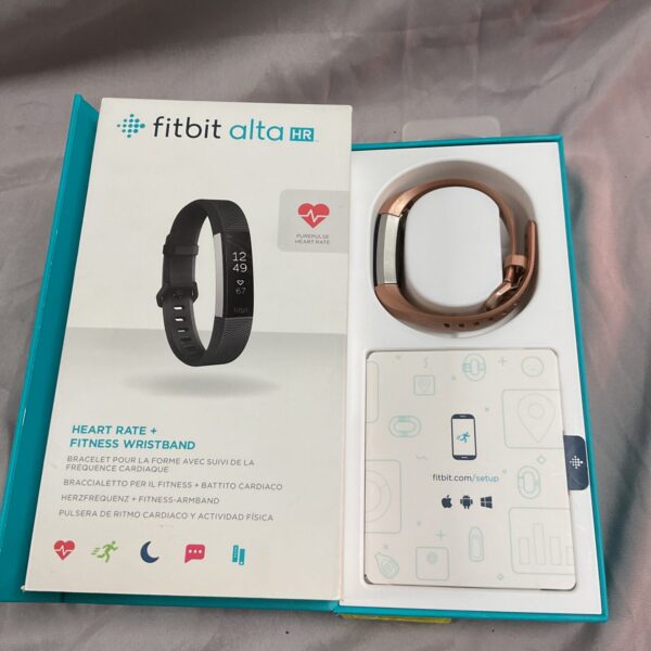 Fitbit Alta HR fitness tracker in original packaging.