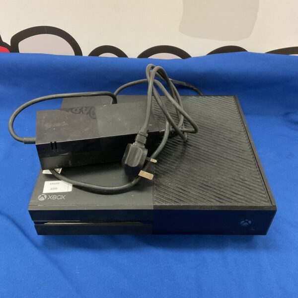 Black Microsoft Xbox One console with power supply unit.