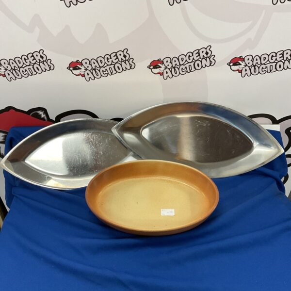 Two inoxium stainless steel serving trays on a white surface.