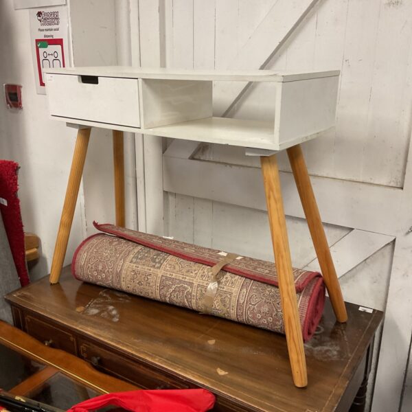 Modern white side table with drawer and wooden legs.