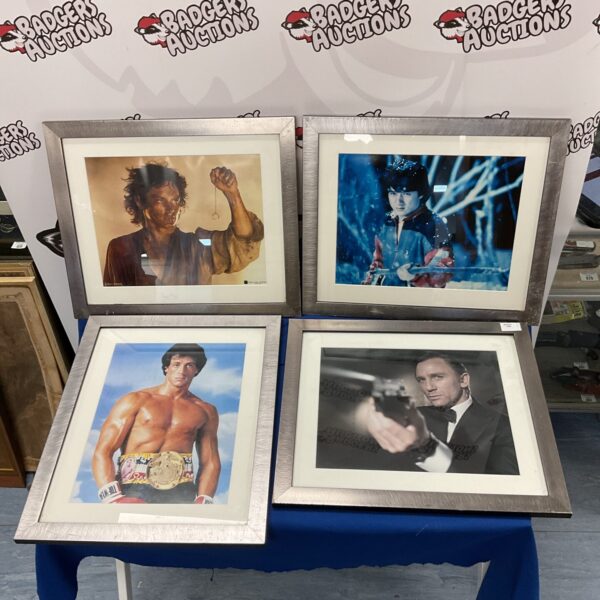 Framed lot of movie prints including James Bond and Rocky.
