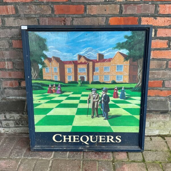Vintage Chequers pub sign with colourful scene and chequered border.